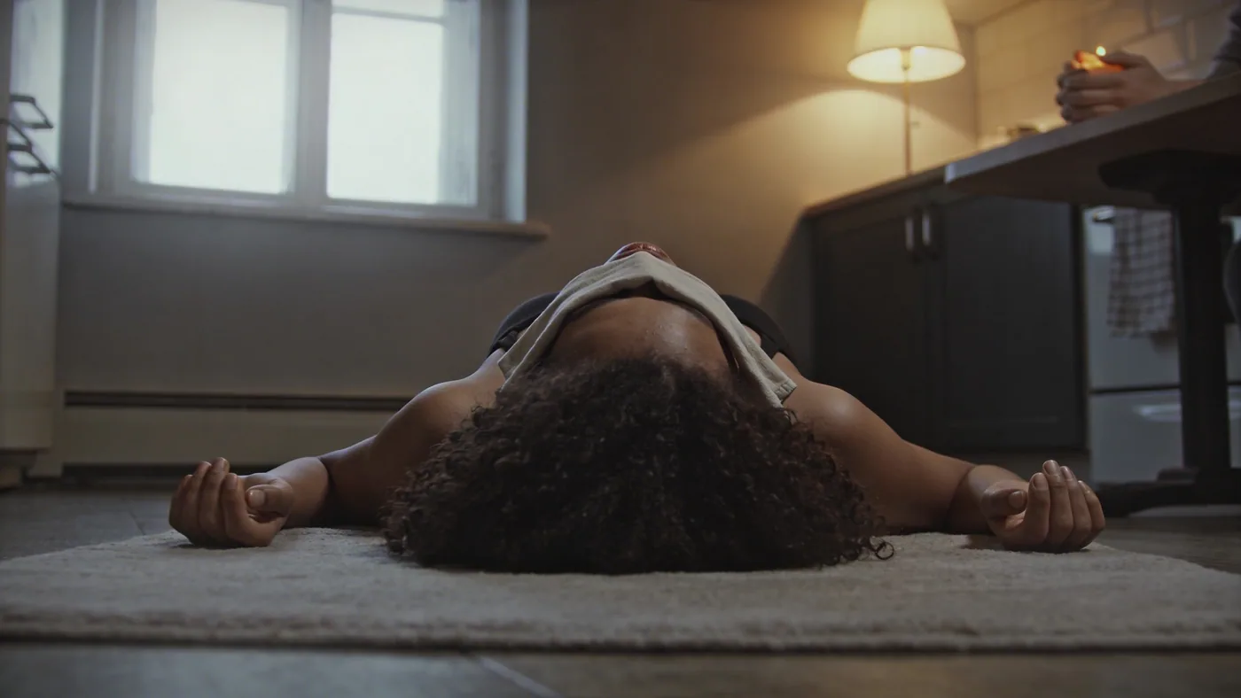 Close-up of hands holding warm ceramic mug on kitchen table, soft light, moment of seeking support for the body — healing the inner child
