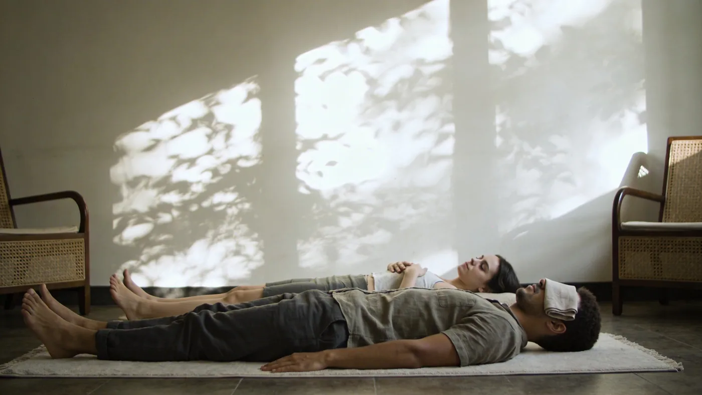 Man lying on his side holding his ribs as emotion rises in the body after massage — emotional release massage