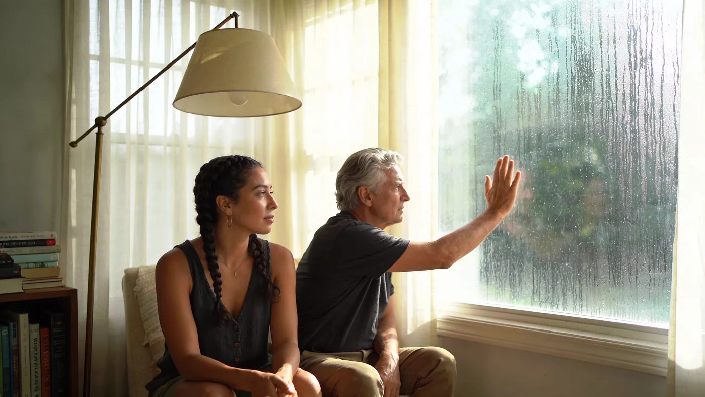 Man pressing palm against rain-streaked window, body still tense when peace feels blocked — how to feel safe in your body spirituality