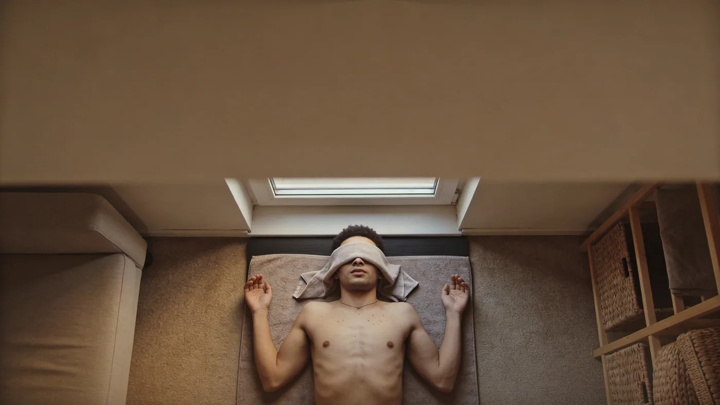 Person at window experiencing multiple anxiety symptoms including chest tightness — chest tightness anxiety