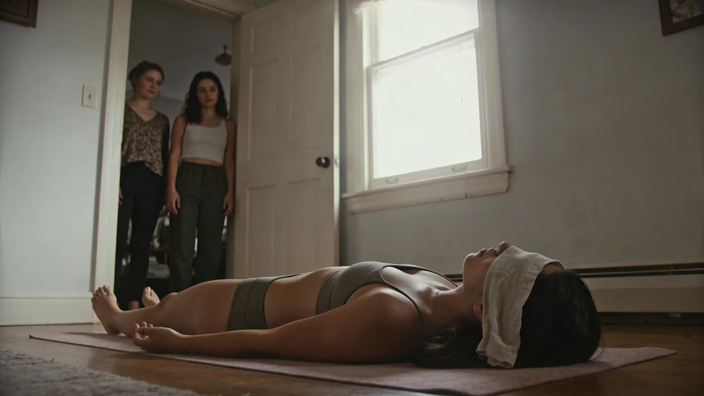 Two women sharing quiet stillness in a doorway illustrating the daily practice of coming home to the body — why do i overthink everything