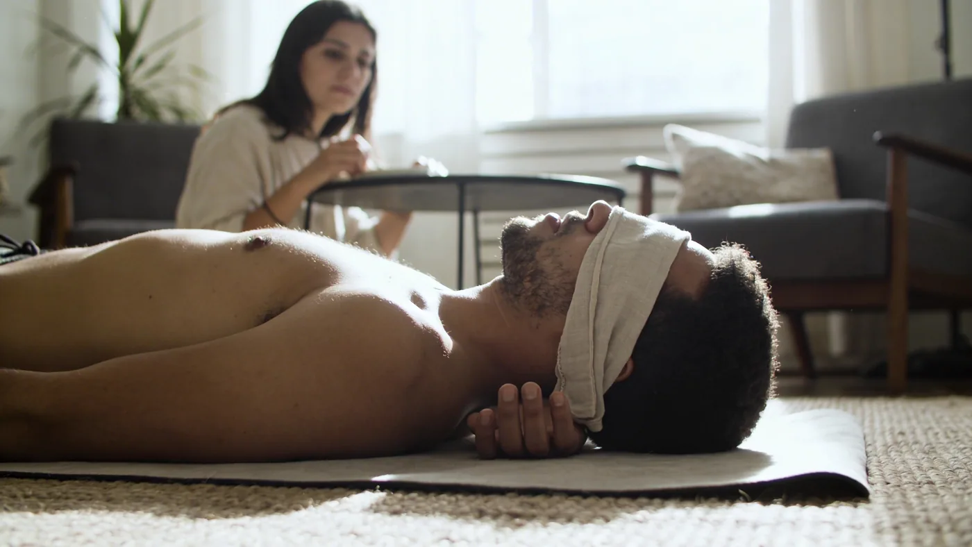 Woman gazing inward while holding a mug at a quiet table, reflecting how inner child wounds surface in daily adult moments