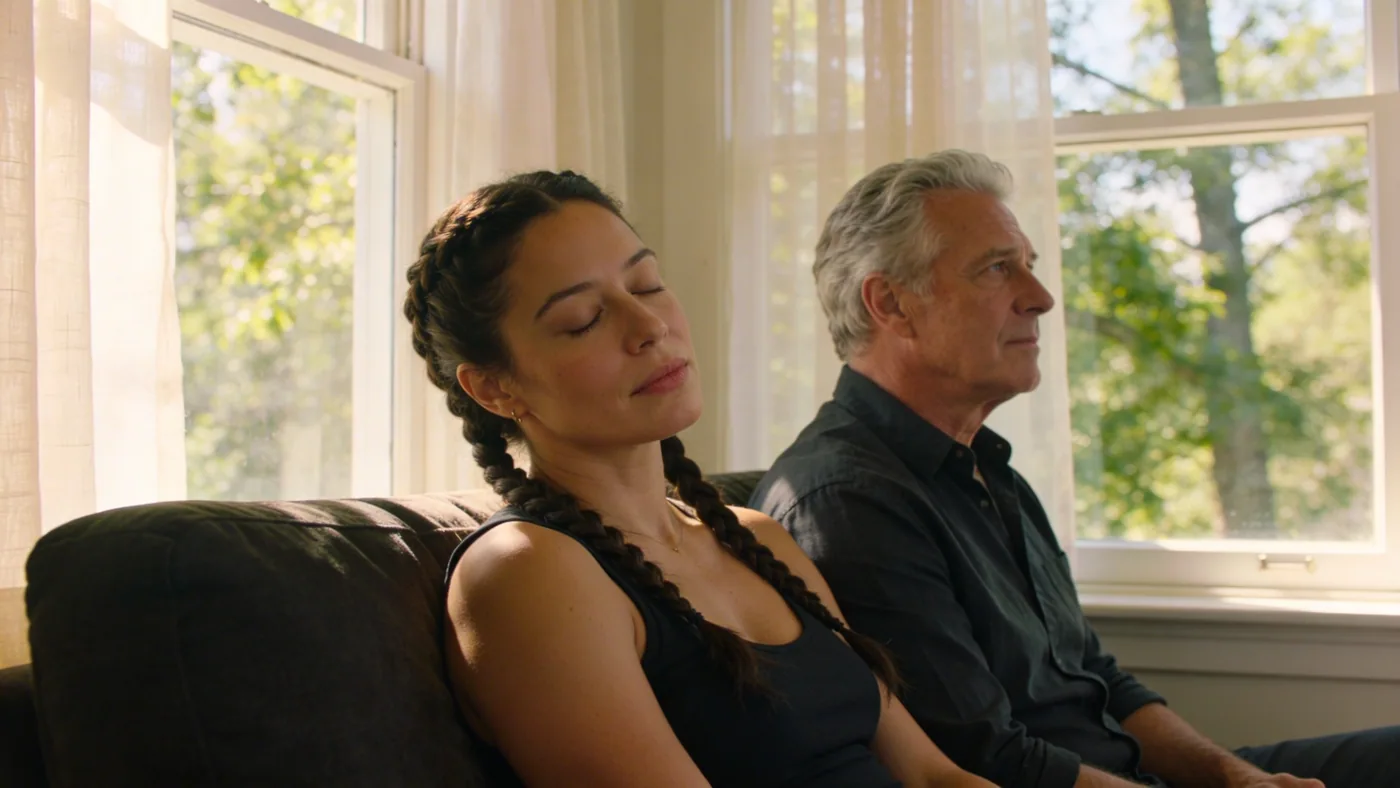 Woman resting on a dim sofa with eyes closed, living with chest tightness anxiety in quiet afternoon stillness