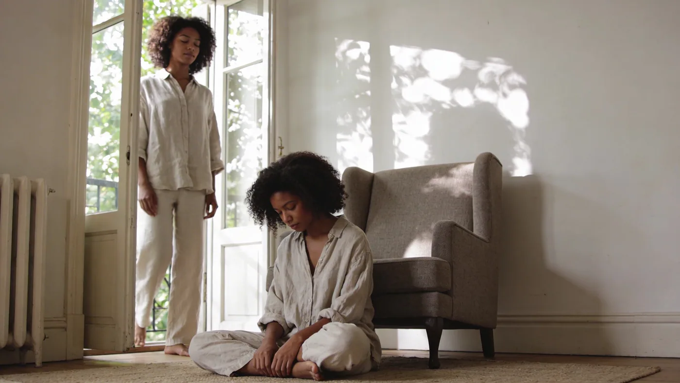 Woman standing near open window with eyes closed feeling the core distinction that clears the fog — Woman standing near open window with eyes closed feeling the core distinction that clears the fog — is my spiritual teacher a narcissist