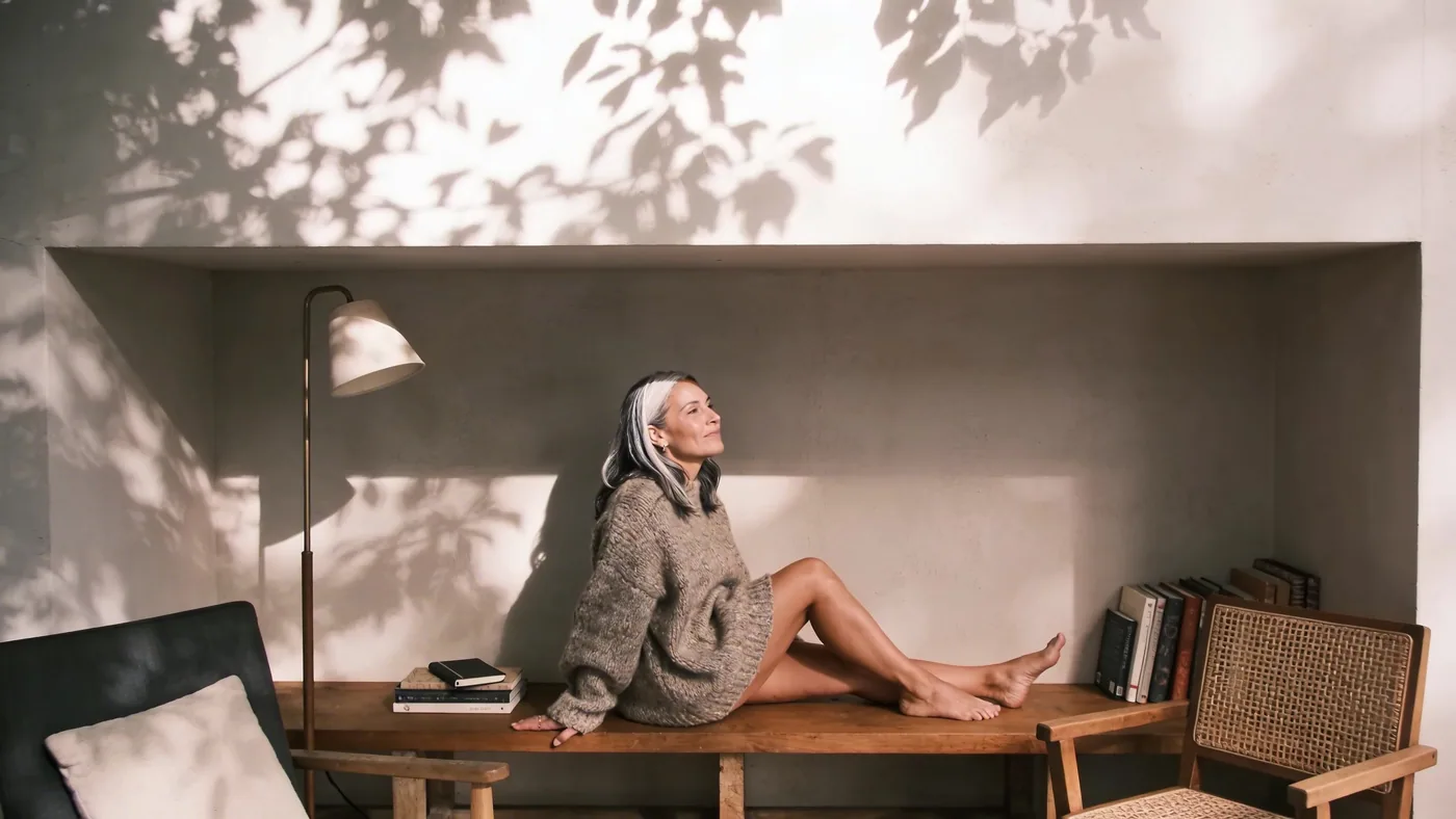 Worn journal and relaxed hand on wooden bench showing what changes after weeks of somatic body practice — somatic practices for nervous system regulation