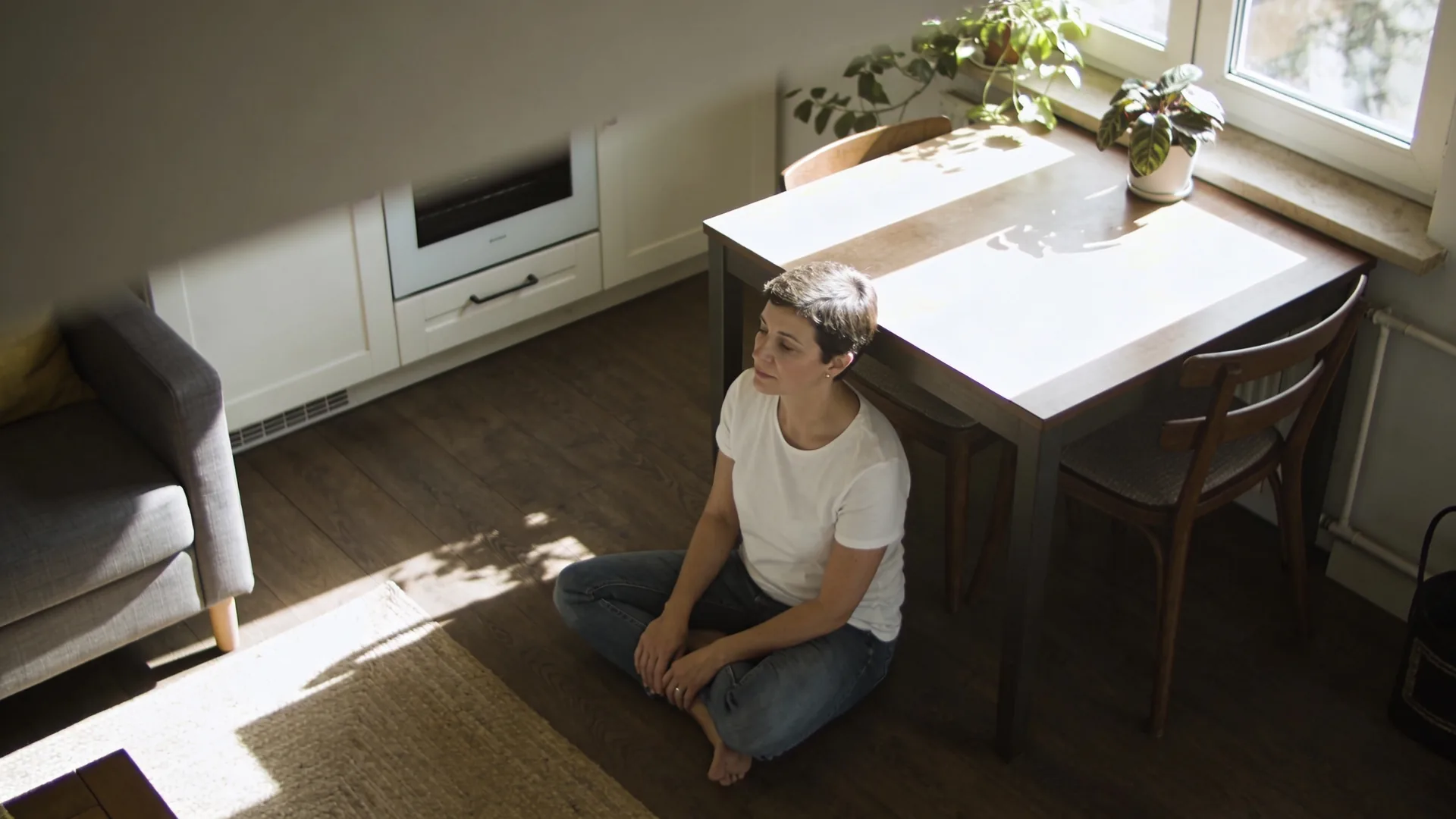 Relaxed open hand beside glass of water on windowsill after honest body-first healing session