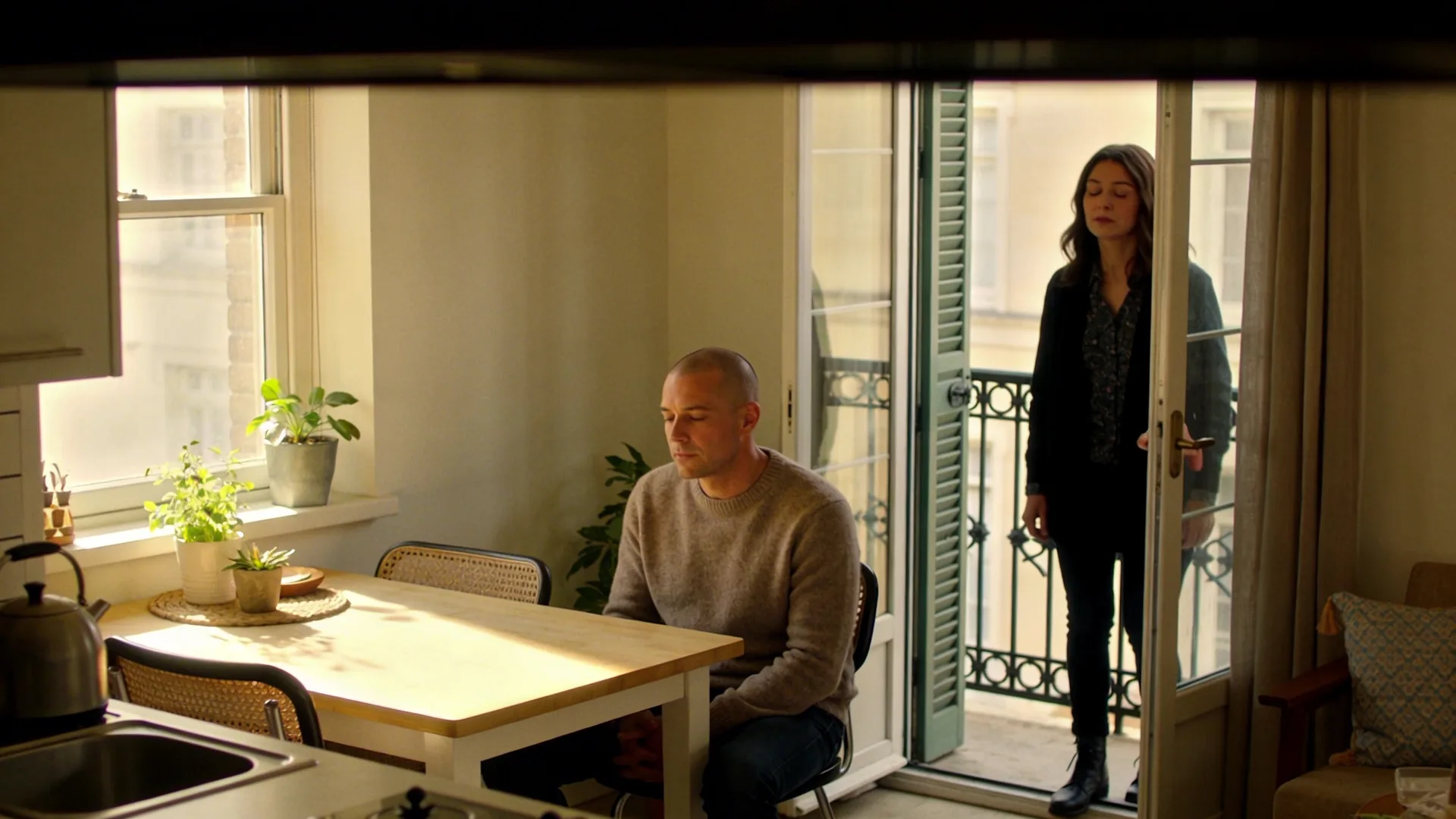 Woman standing at open balcony door eyes closed, exploring why you keep searching for a childhood trauma test