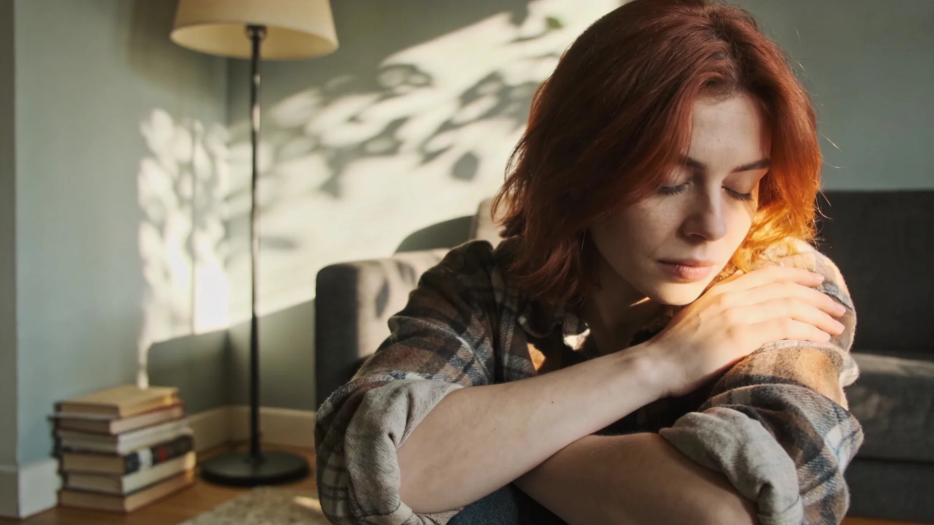 Woman lying in Feeling Session posture with eyes covered showing safety through stillness for disorganized attachment style