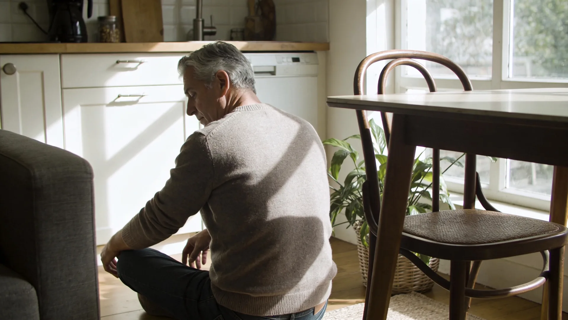 Man leaning forward in conversation at café table showing what changes after emotional validation in real moments