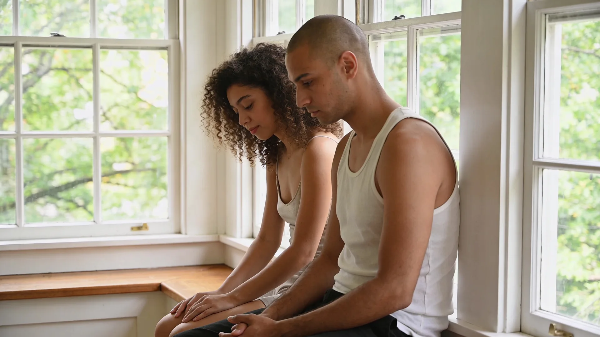 Two people sitting quietly together on front stoop showing what shifts when you stop fighting yourself in attachment