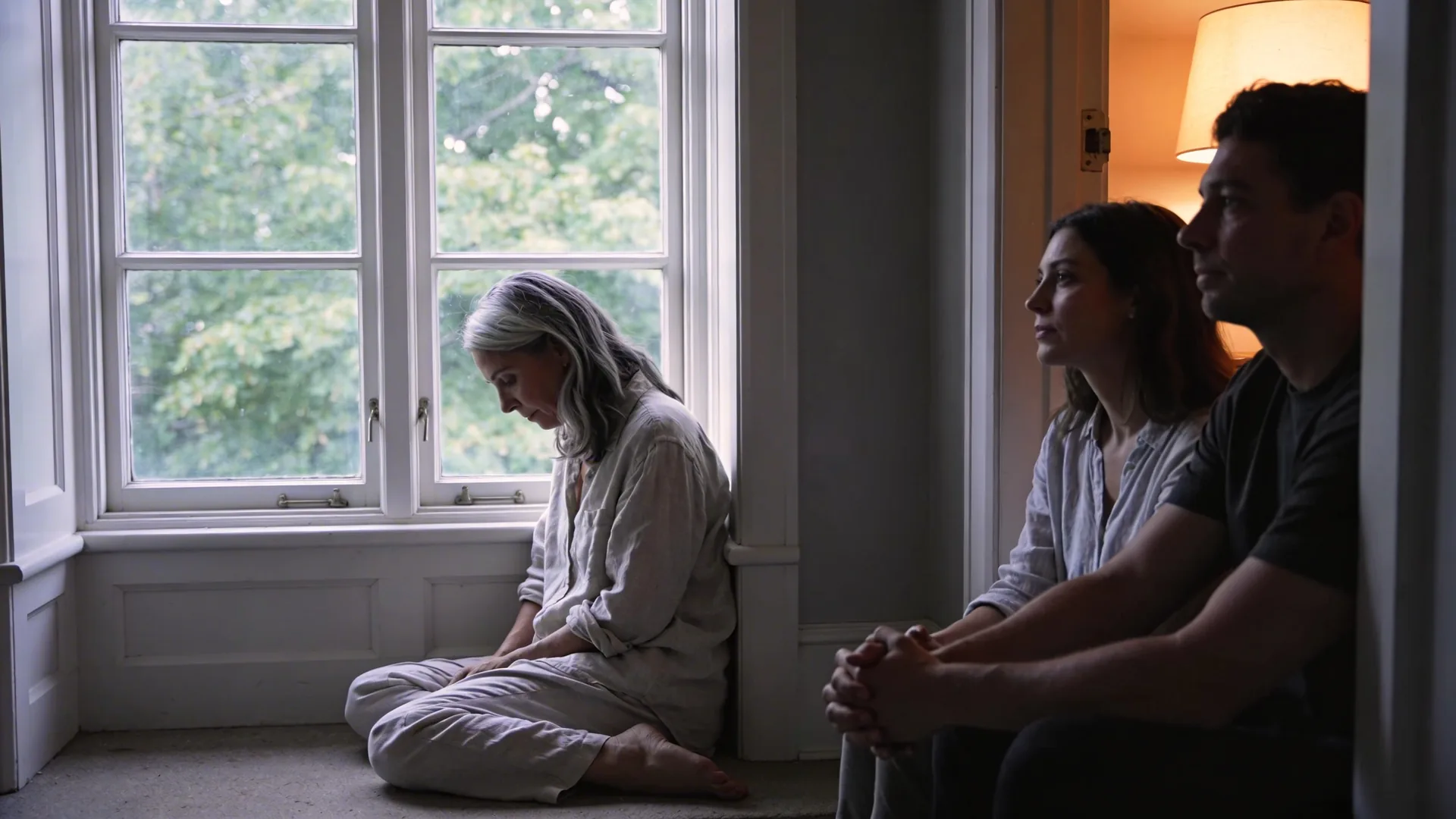 Two people sitting quietly in a doorway with hands nearly touching showing what healing actually looks like over months