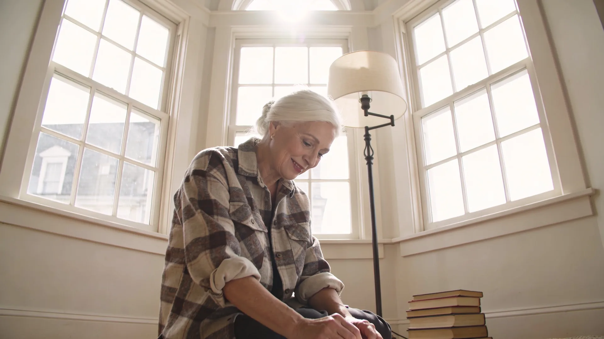 Two people sitting on porch steps creating safe emotional space with another person through quiet presence