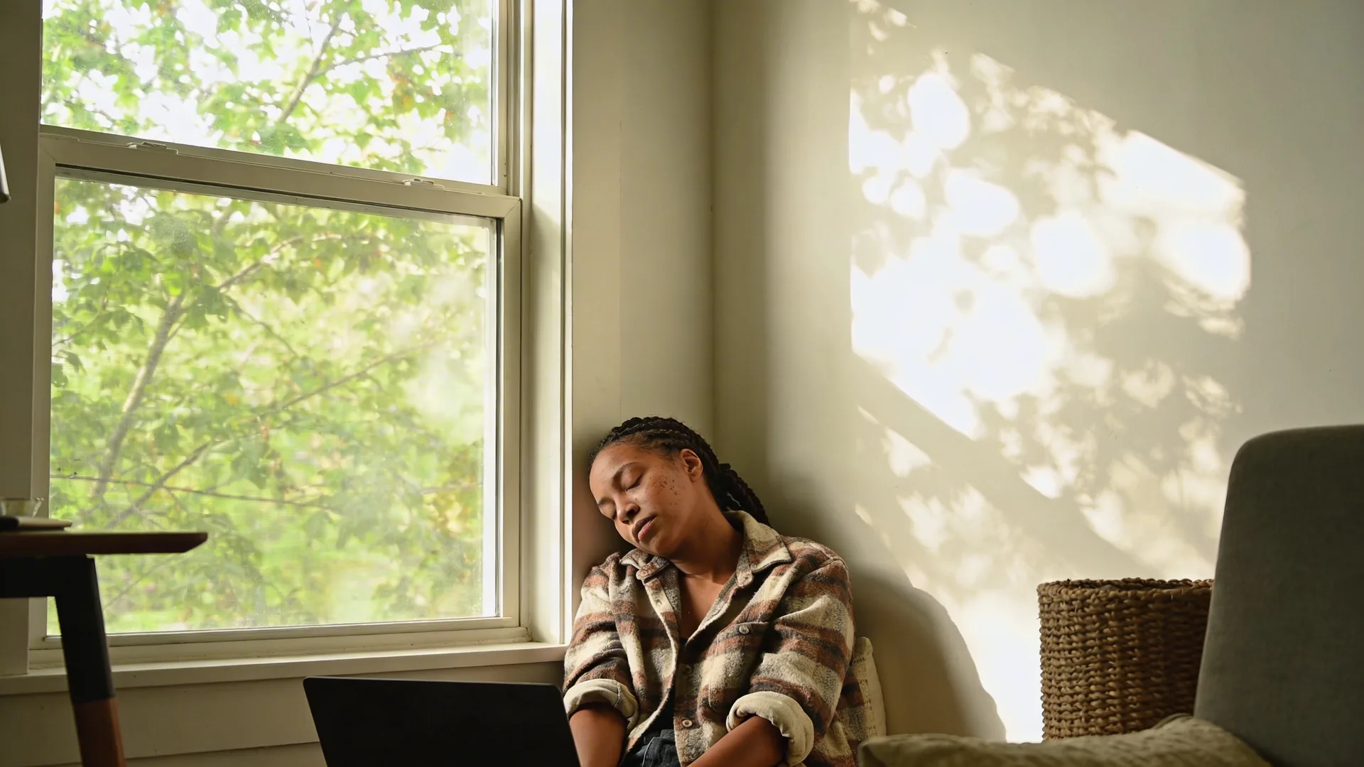 Woman leaning back exhausted at desk with eyes closed showing why burnout recovery takes longer than expected