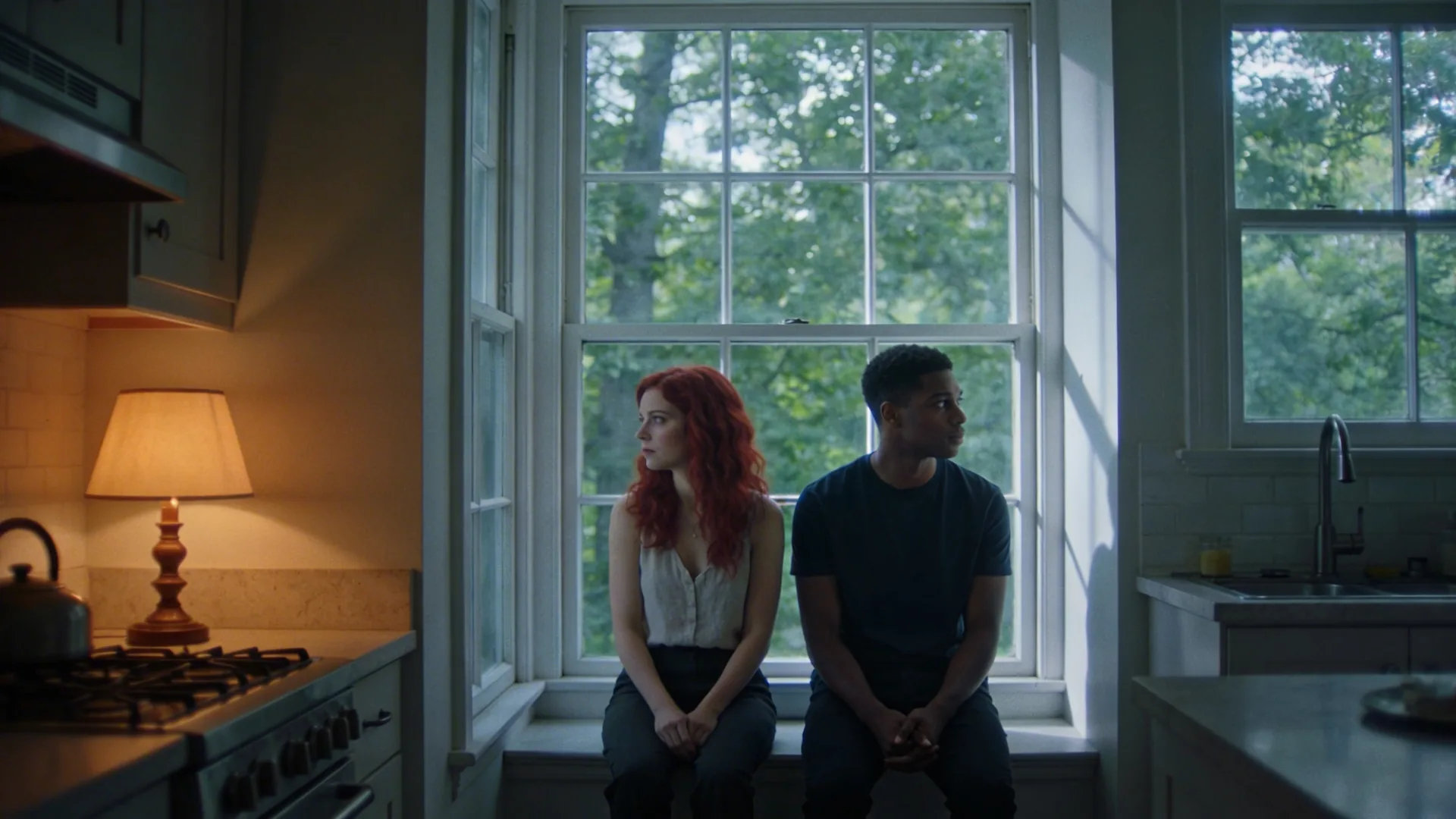 Couple in sunlit kitchen standing apart showing how to strengthen emotional intimacy when love feels distant