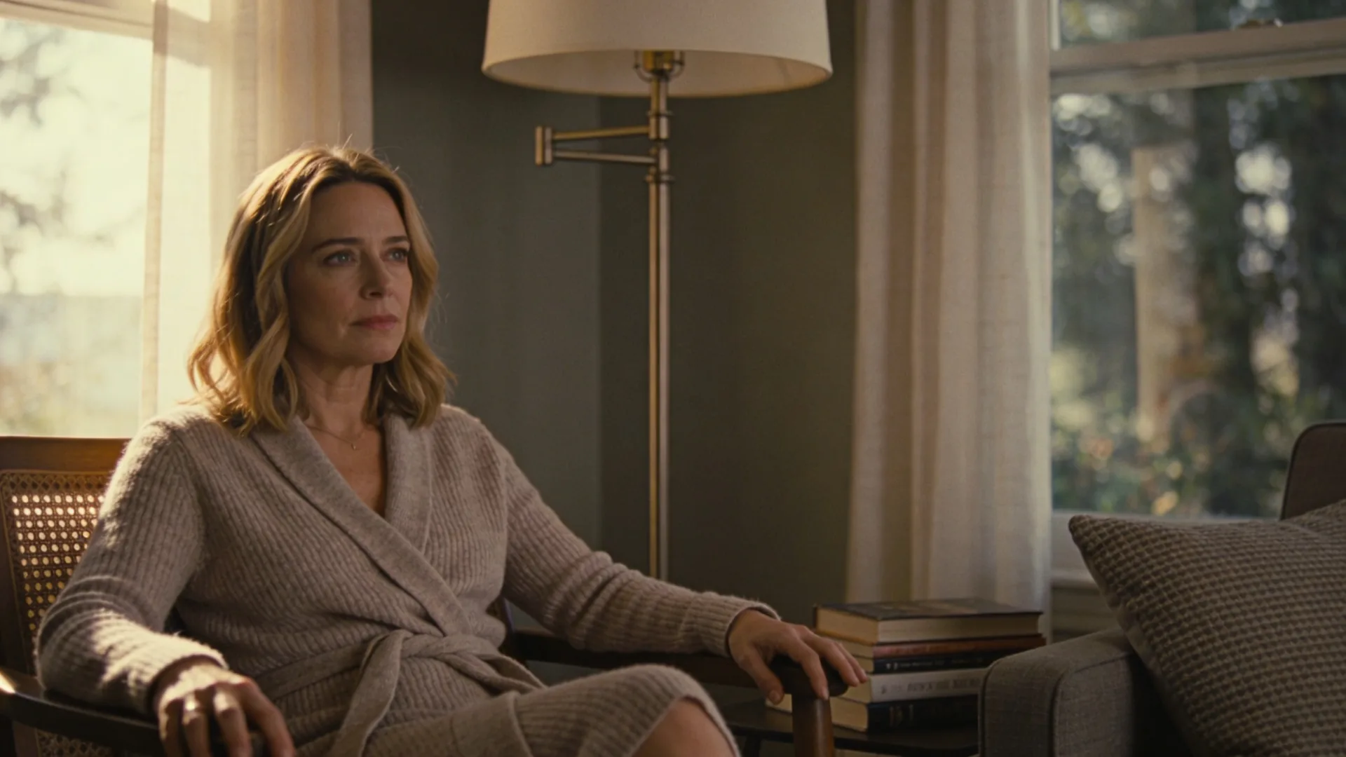 Woman at bathroom mirror looking down at her hands finding a grounded practice to find direction not pressure
