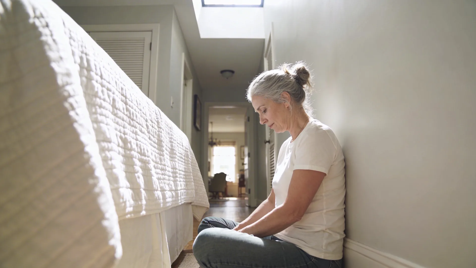 Sunlit hallway in a home representing what softened and what remains true after shadow work healing