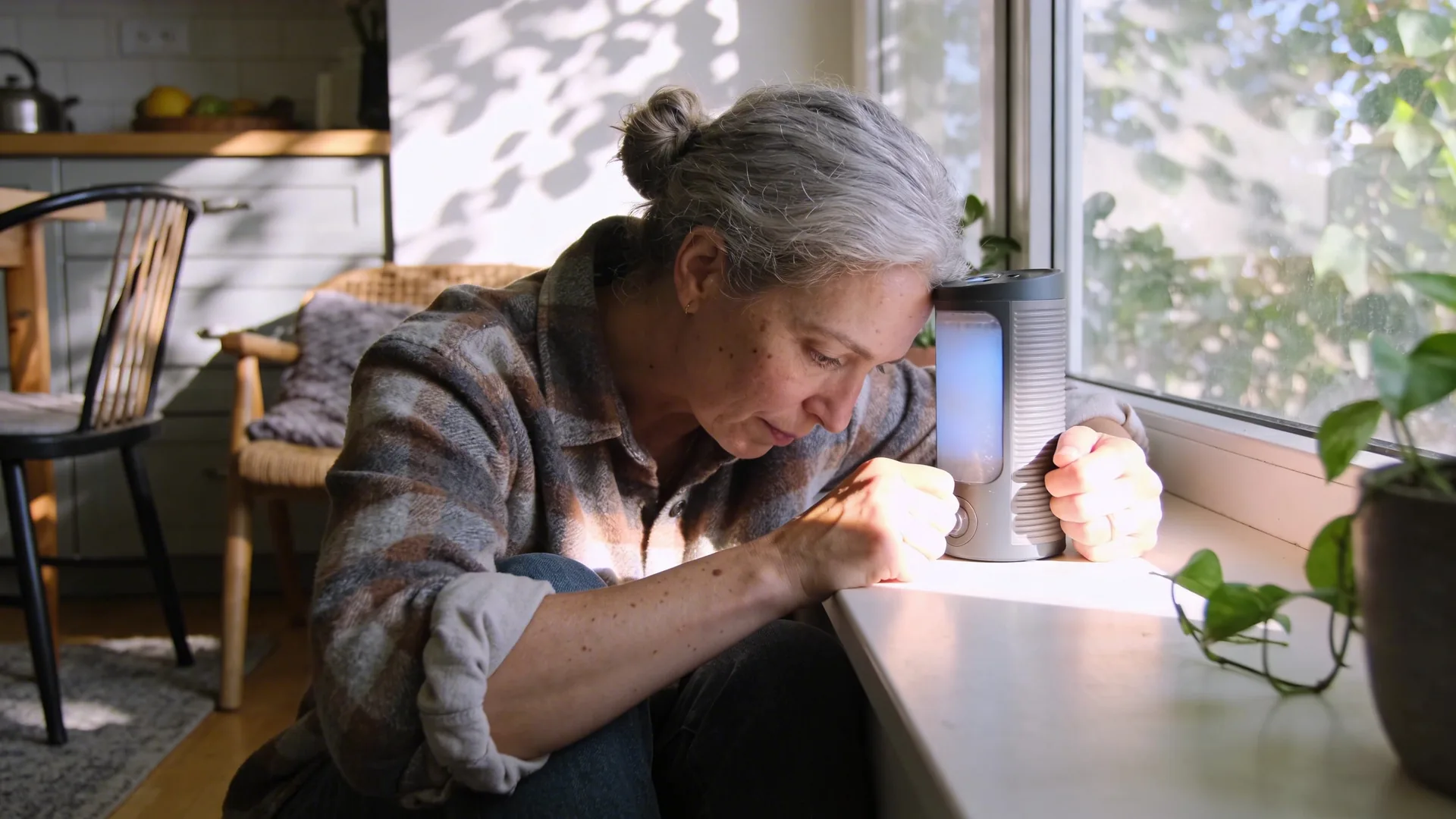 Woman's tense hands beside cooling tea on kitchen table showing why shadow work questions stop working in the head
