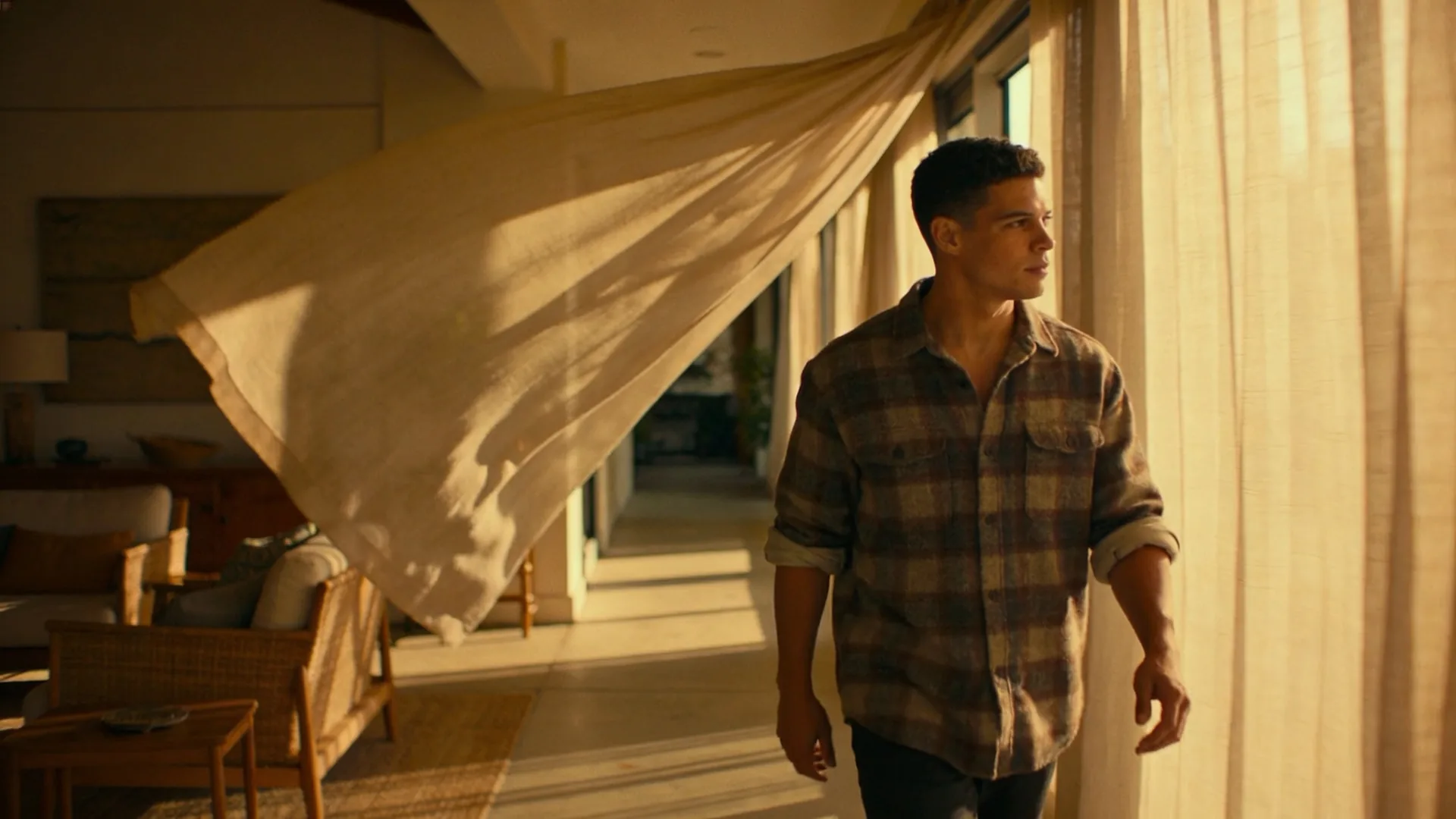 Two people sitting apart in a kitchen doorway with emotional distance between them, showing the pattern underneath unstable safety not constant cruelty