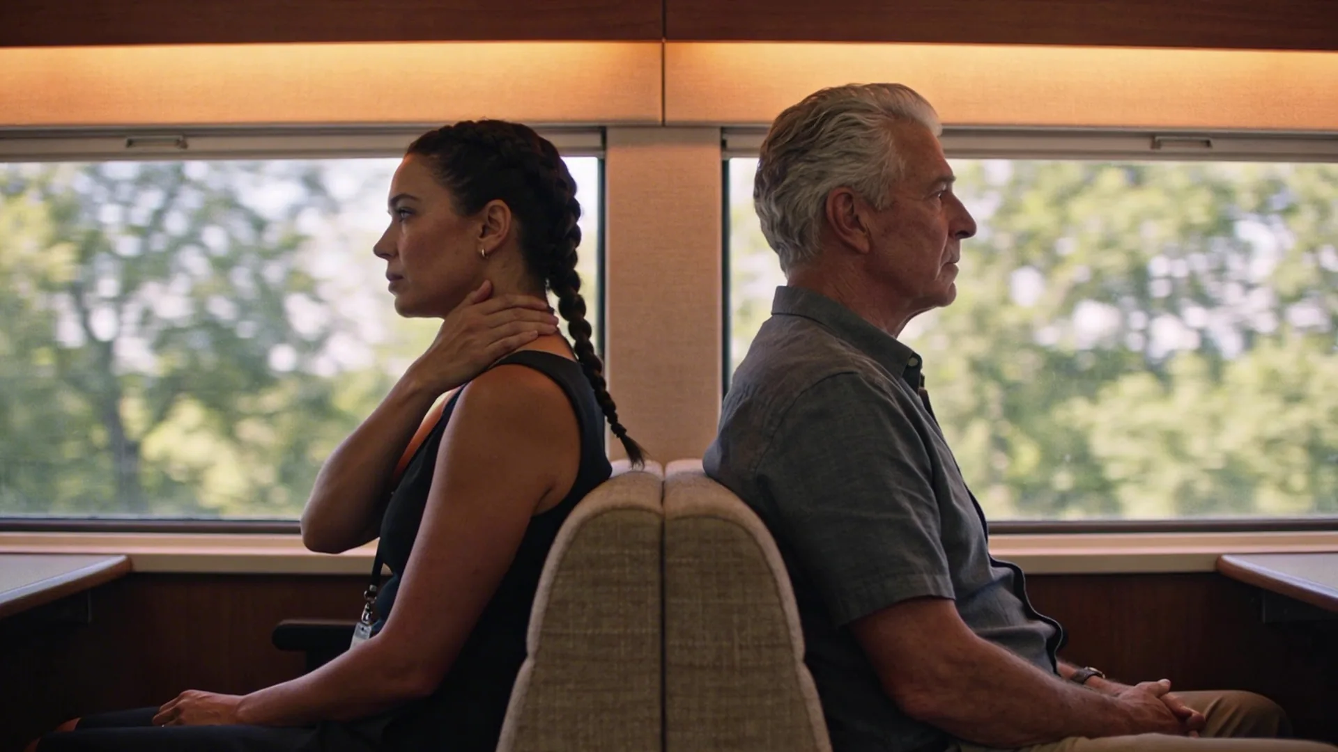 Man pressing his neck near office window showing when inner life breaks before outer life does